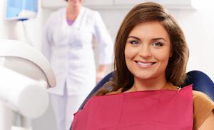 A woman smiles in the dental chair in Evansville