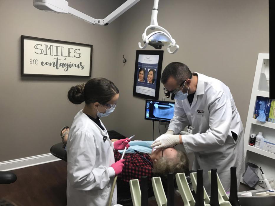 Dr. Meunier works on a patient | Dentist Evansville IN