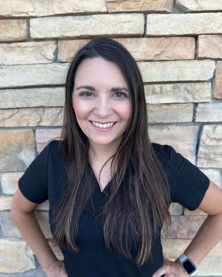 ashley, our receptionist, smiling for the camera | general dentist evansville